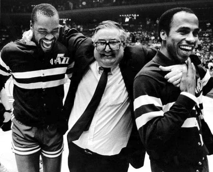 Jeff Wilkins, left, coach Frank Layden and Darrell Griffith celebrate a Utah Jazz win.