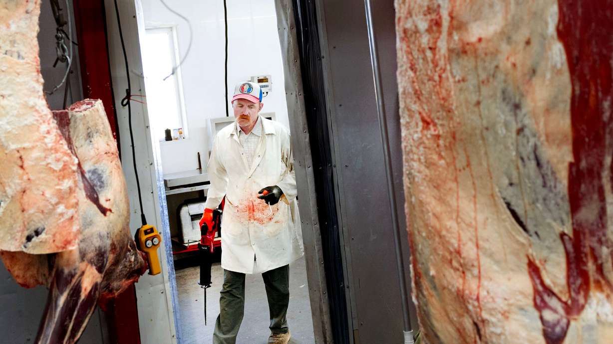Aaron Rees, owner and operator of Provident Meat Company, works at his meat-cutting business in Fillmore on July 30. Beef prices in the United States have been steadily increasing and recently reached record highs.