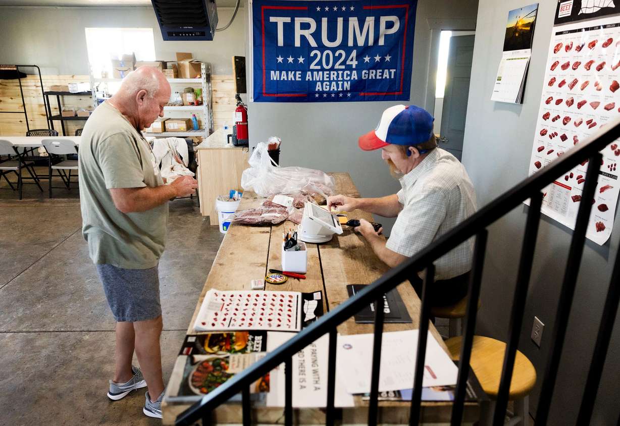 Brad Marshall purchases beef from Aaron Rees, owner and operator of Provident Meat Company, in Fillmore on July 30.