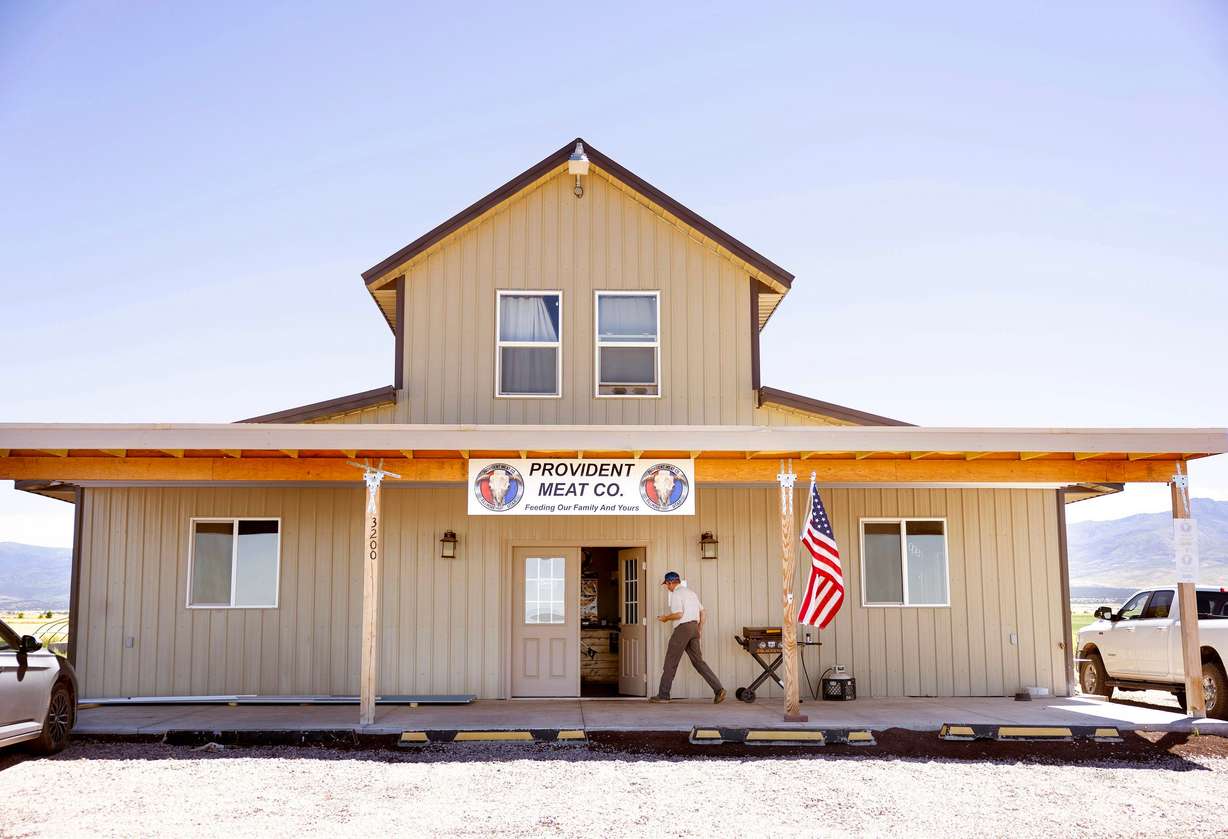 Aaron Rees, owner and operator of Provident Meat Company, cooks lunch for his employees at his meat cutting business in Fillmore on July 30.