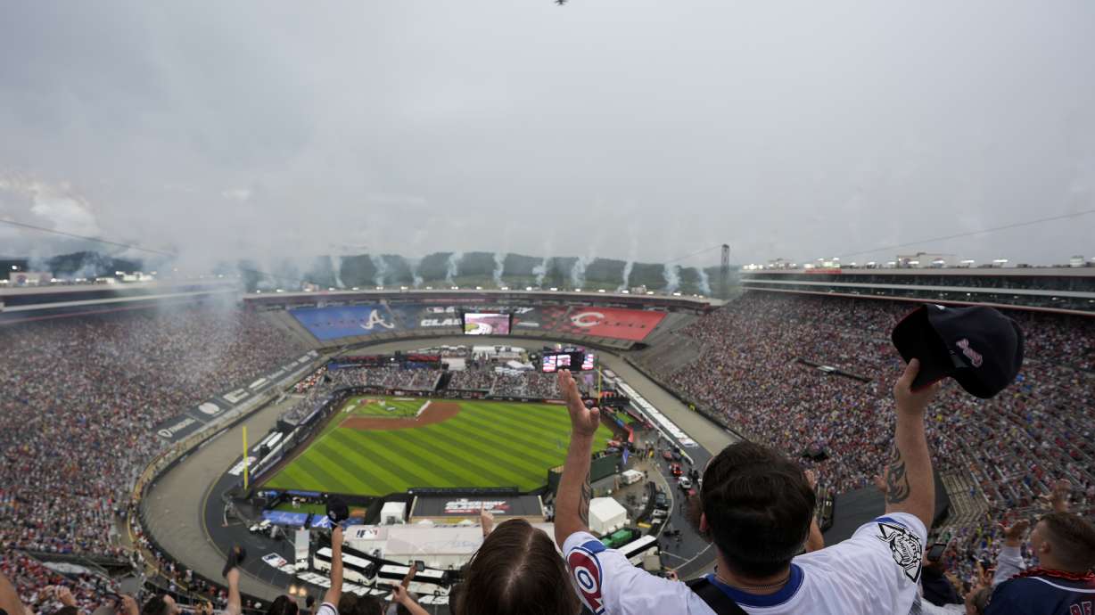 Fans cheer during a flyover before the MLB Speedway Classic baseball game between the Atlanta Braves and the Cincinnati Reds at Bristol Motor Speedway in Bristol, Tenn., Saturday, Aug. 2, 2025.