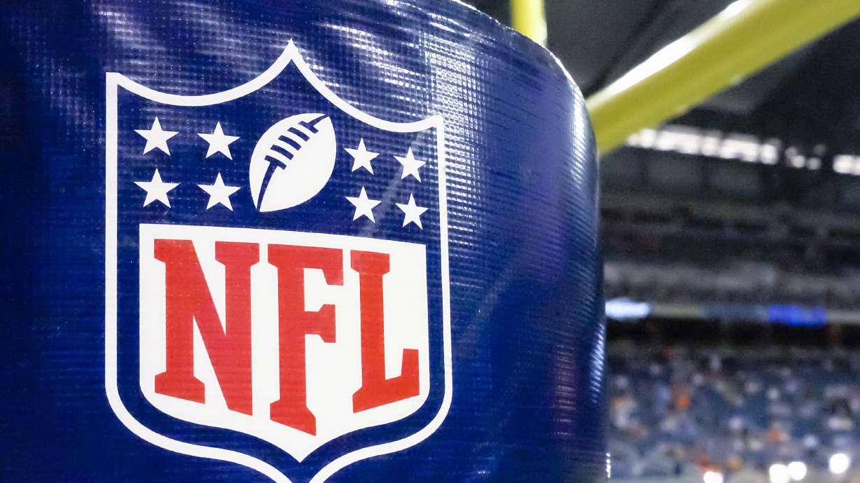 FILE - An NFL logo on a goal post pad before a preseason NFL football game between the Detroit Lions and the Cleveland Browns at Ford Field in Detroit, Aug. 9, 2014.