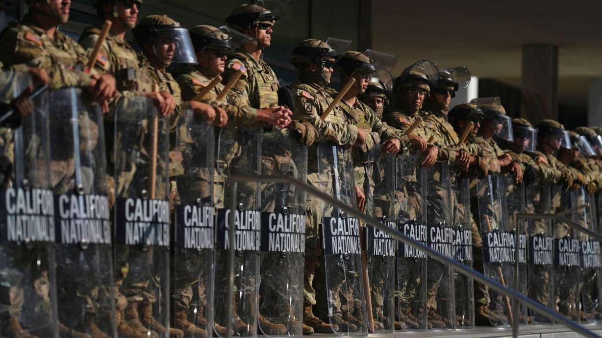 California National Guard are positioned at the Federal Building on June 10, in downtown Los Angeles. Half of Utah voters surveyed said they strongly or somewhat approve, a new poll shows.