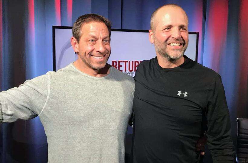 Jon Absey stands with his friend Neil Anderson after they filmed an episode of "Return to Real" for Anderson's YouTube channel in January 2020.