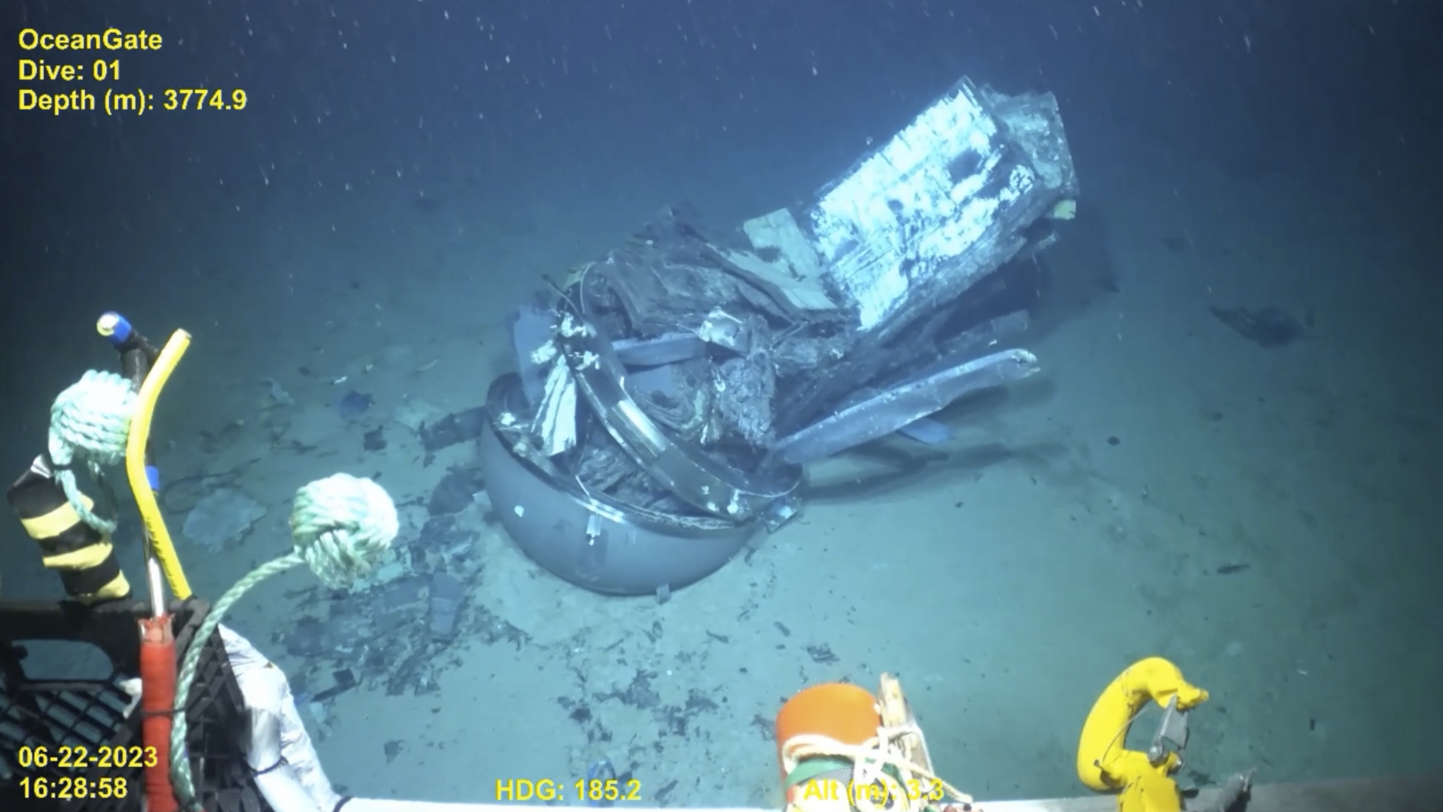 The remains of the Titan submersible, center, sits on the floor of the Atlantic Ocean.