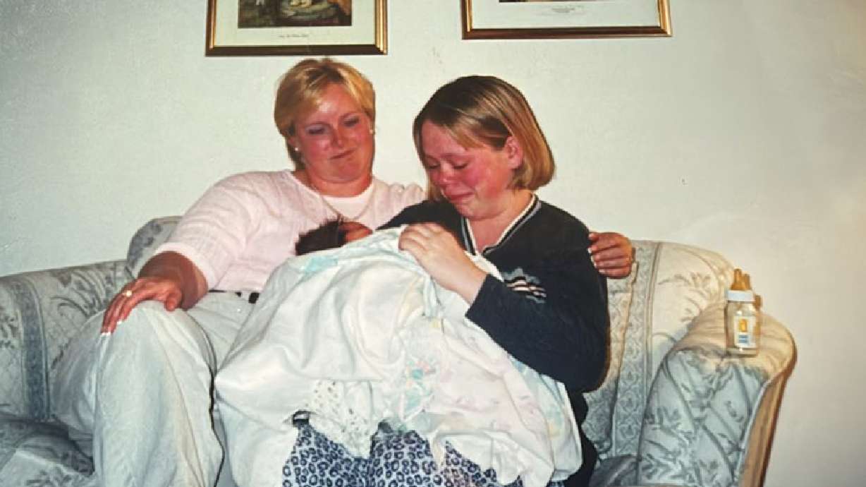 Naomi Randall at 1 day old, being given up by her biological mom, Nikki, to her adoptive mom, Teri, on June 4, 2001. Randall recently reunited with her biological mother after finding her on Facebook.