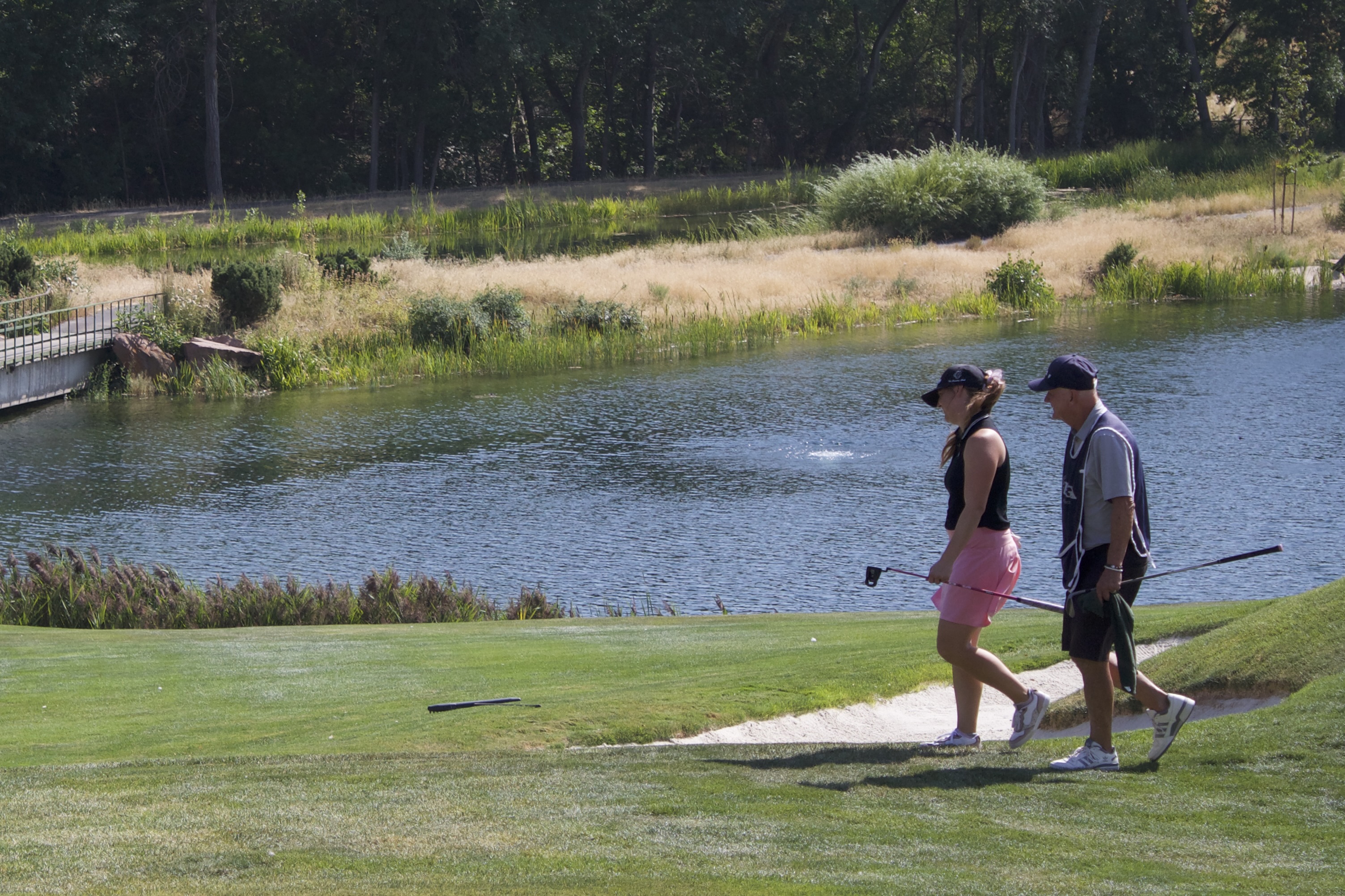 Bountiful's Haley Sturgeon walks off the 18th hole with her caddy and father at the Utah Women's Open at The Country Club of Salt Lake, Tuesday, Aug. 5, 2025 in Salt Lake City.