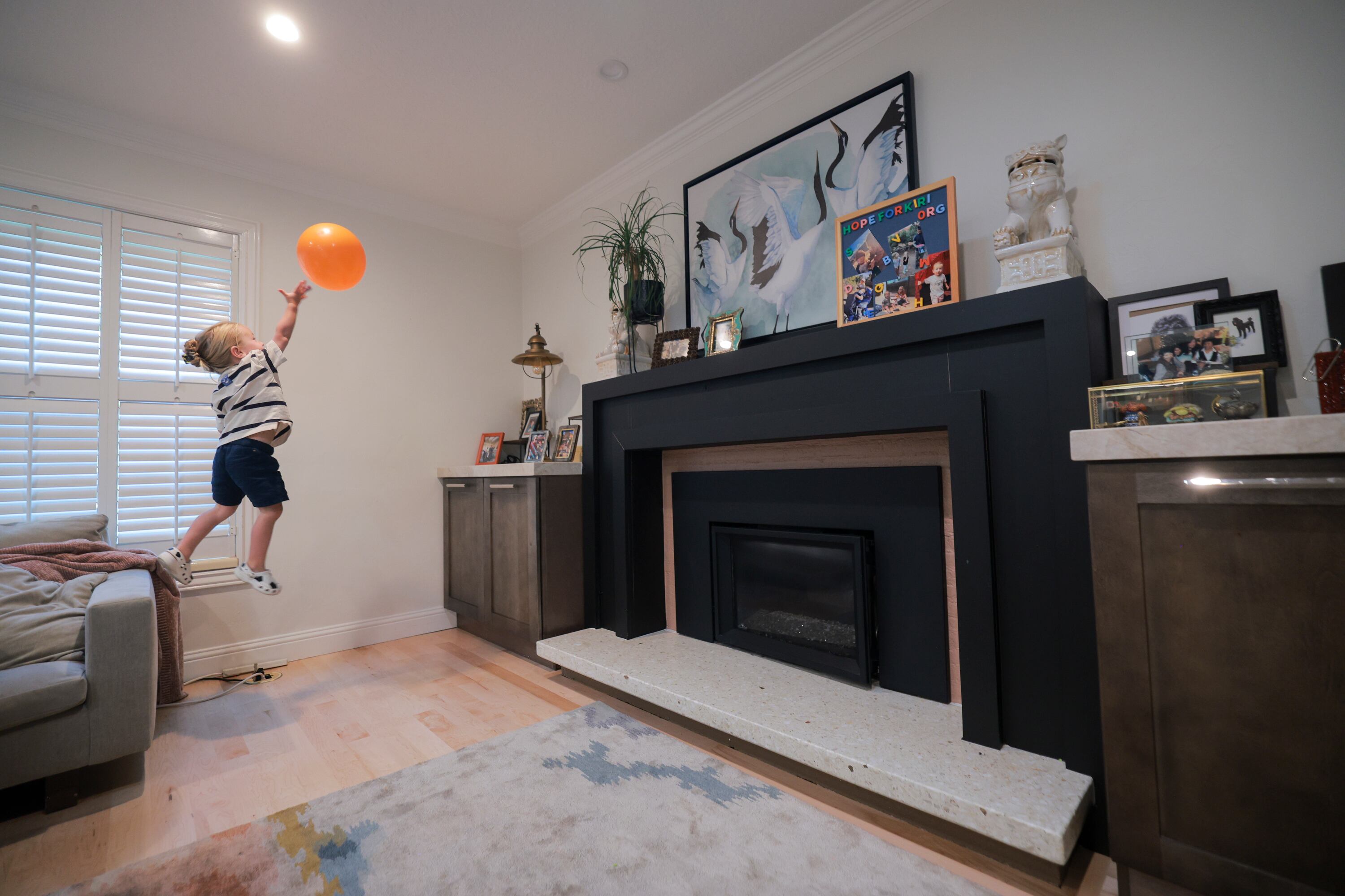 Kiri Duke-Rosati, 3, leaps off the couch as he plays “keepy uppy” with a balloon in his home in Holladay on Monday. His parents are searching for a bone marrow donor that could save his life.