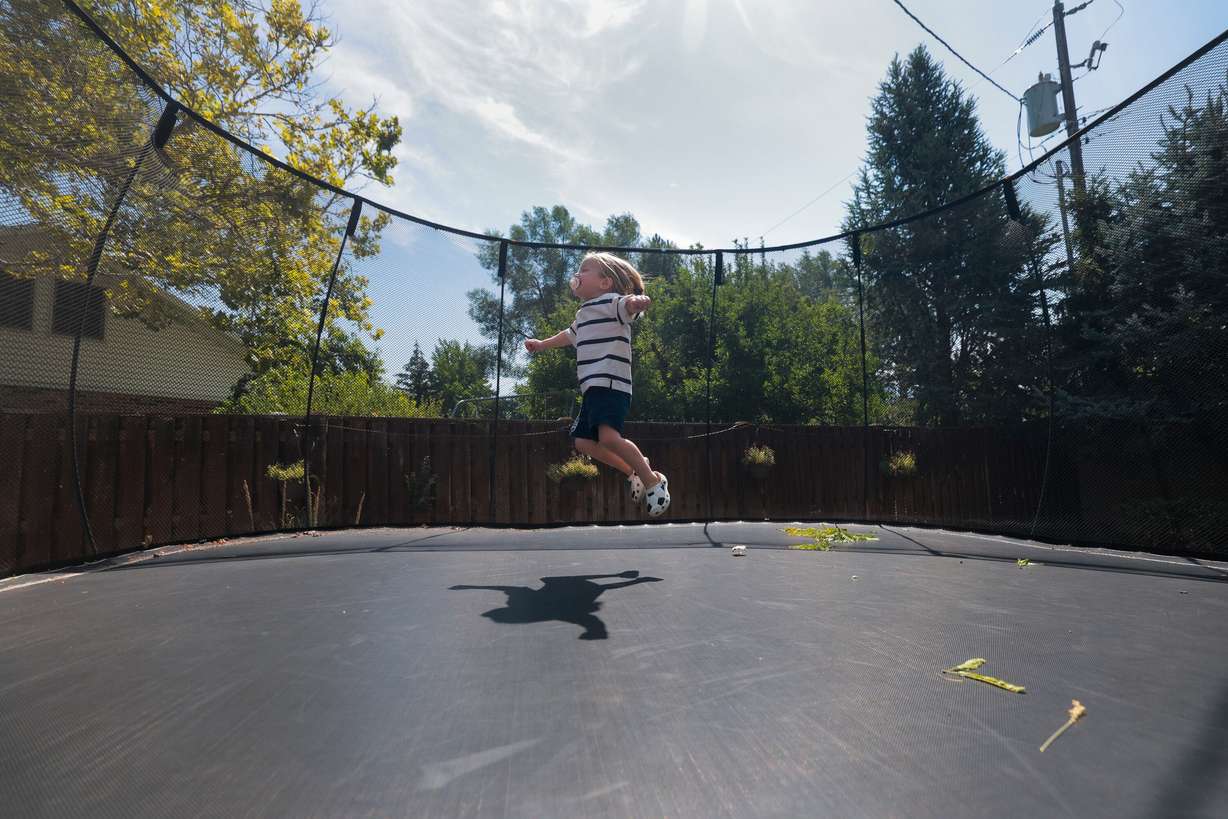 Kiri Duke-Rosati, 3, bounces on the trampoline at his Holladay home on Monday. A bone marrow transplant could give Duke-Rosati a normal life, doctors said to his parents.