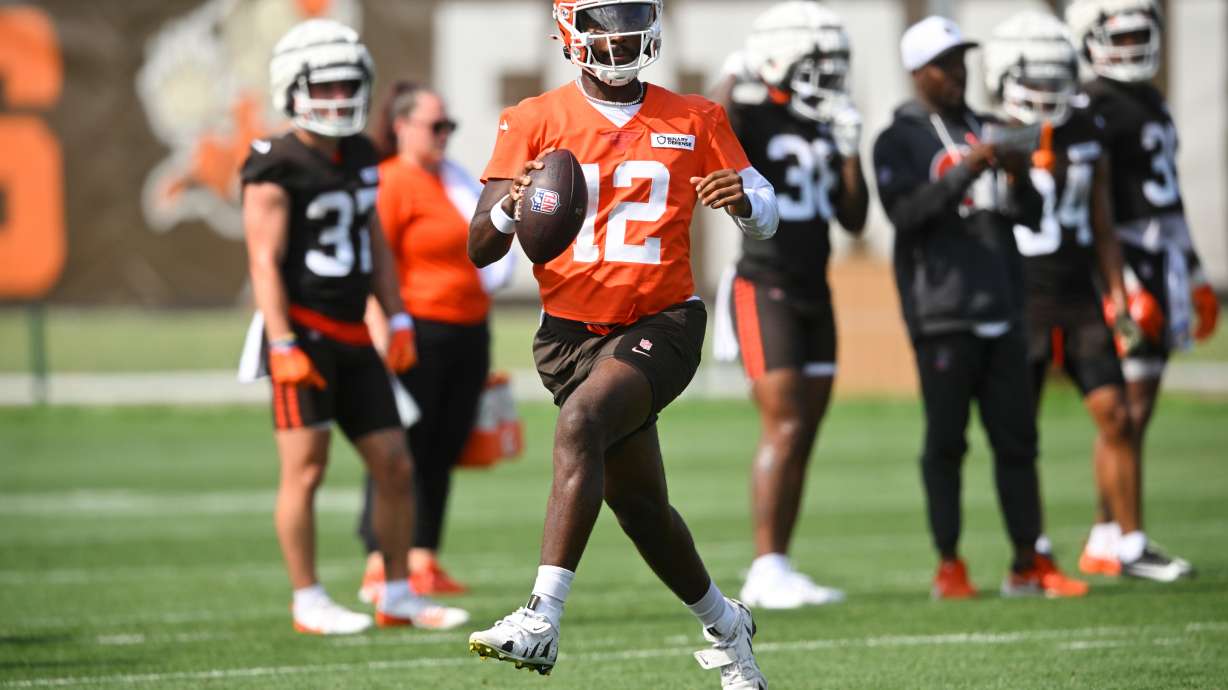 FILE - Cleveland Browns quarterback Shedeur Sanders (12) scrambles during practice at the team's NFL football training camp, Saturday, July 26, 2025, in Berea, Ohio.