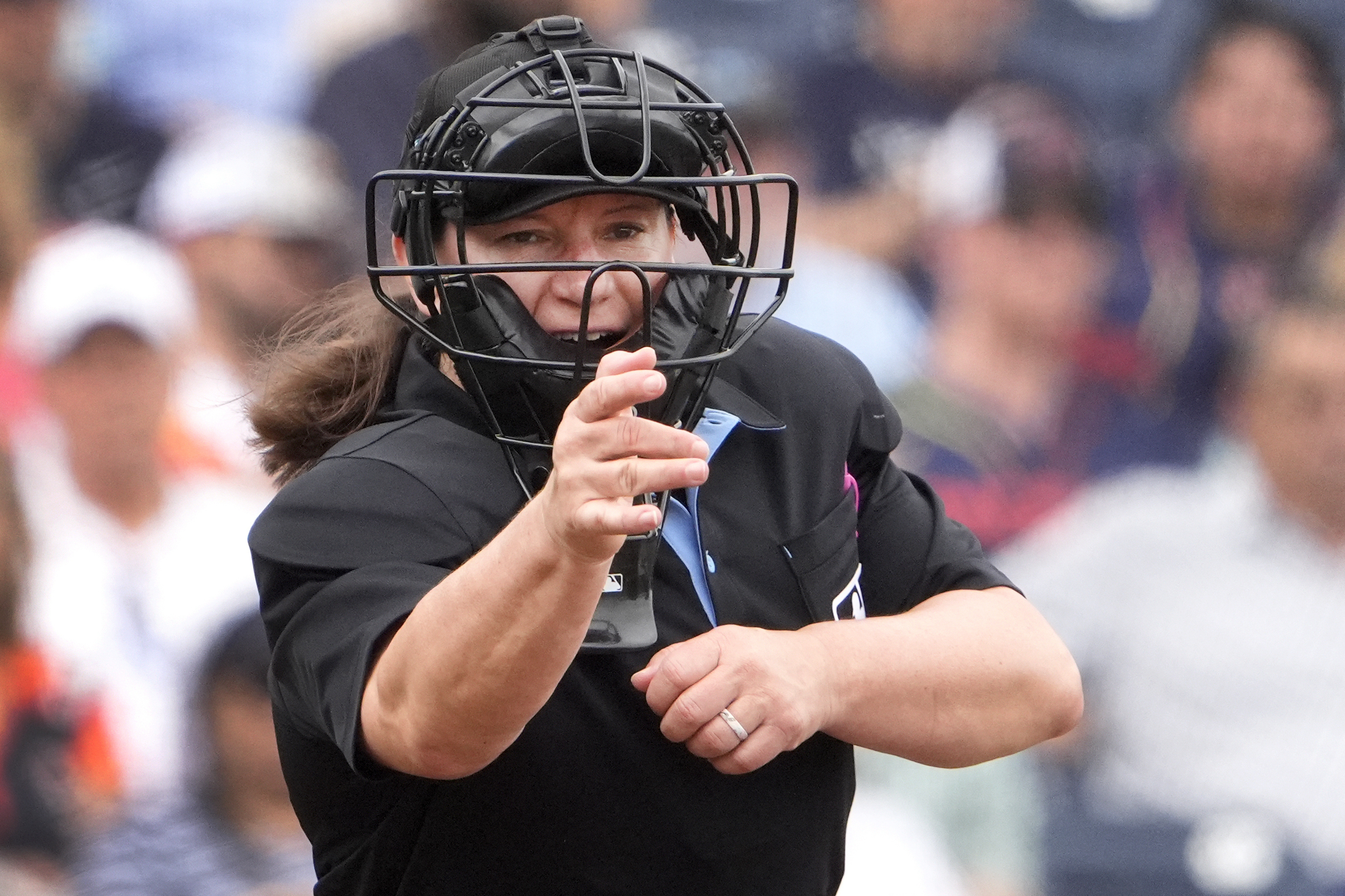 FILE - Home plate umpire Jen Pawol calls a strike during the third inning of a spring training baseball game between the Miami Marlins and Houston Astros, Sunday, March 10, 2024, in West Palm Beach, Fla.