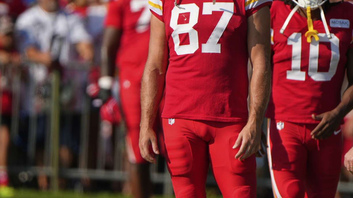 Kansas City Chiefs tight end Travis Kelce (87) waits to stretch at NFL football training camp Tuesday, Aug. 5, 2025, in St. Joseph, Mo.