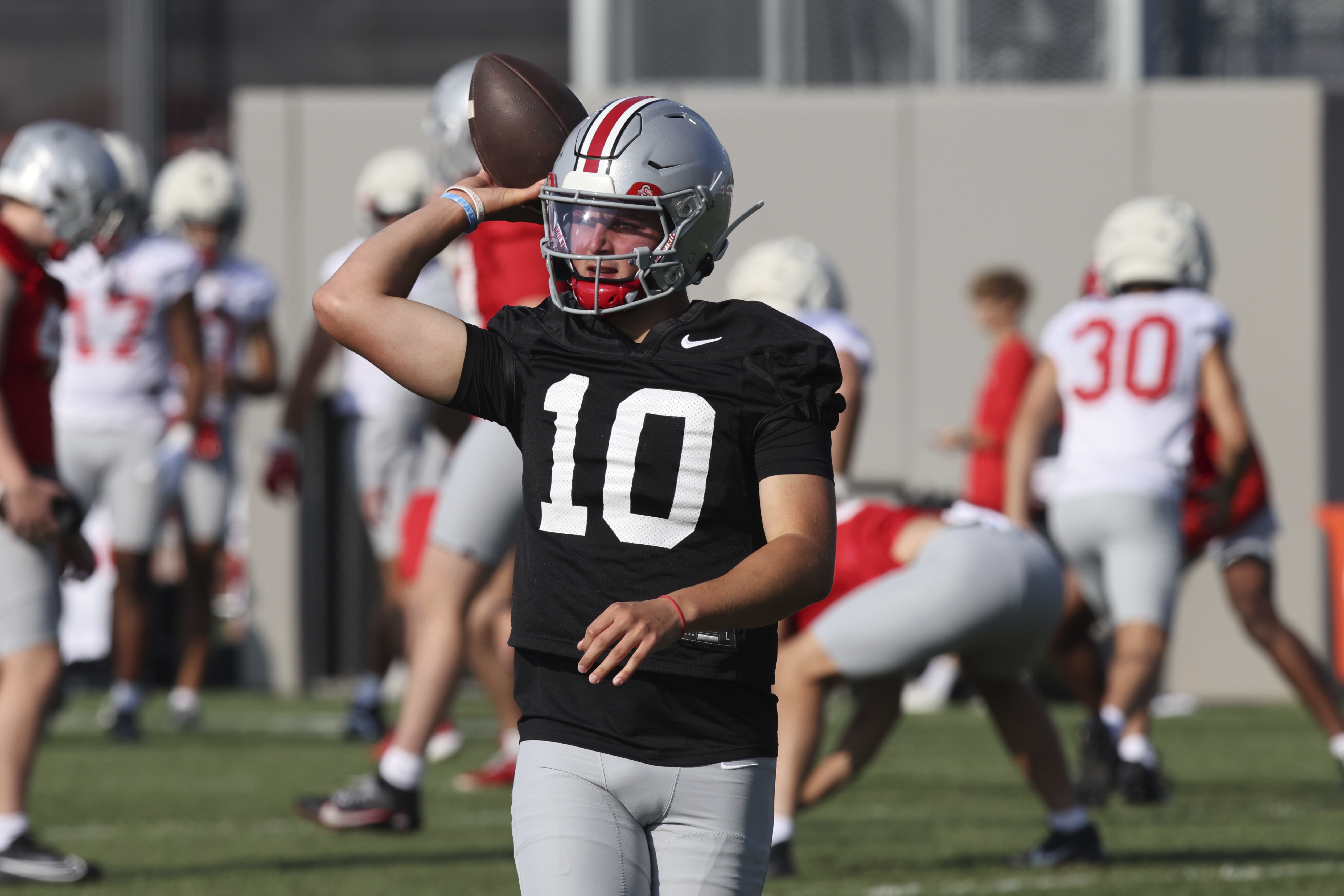 Ohio State quarterback Julian Sayin participates in a drill during NCAA college football practice in Columbus, Ohio, Friday, Aug. 1, 2025.