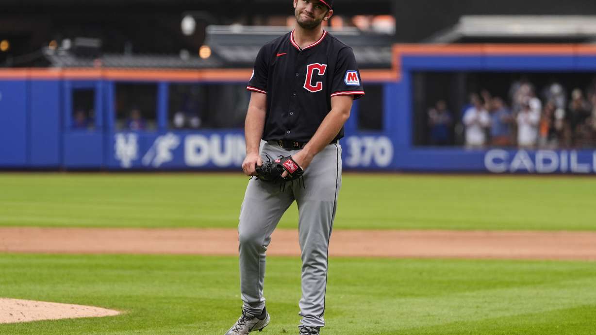 Cleveland Guardians pitcher Gavin Williams (32) reacts after giving up a hit during the ninth inning of a baseball game against the New York Mets, Wednesday, Aug. 6, 2025, in New York.