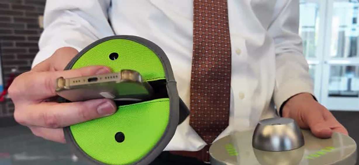 Tyler Howe, former principal at Granger High School, shows KSL a pouch that holds students' cellphones during school, Wednesday, in West Valley City. He said he’s thrilled about the outcomes he’s seen from the new policy.