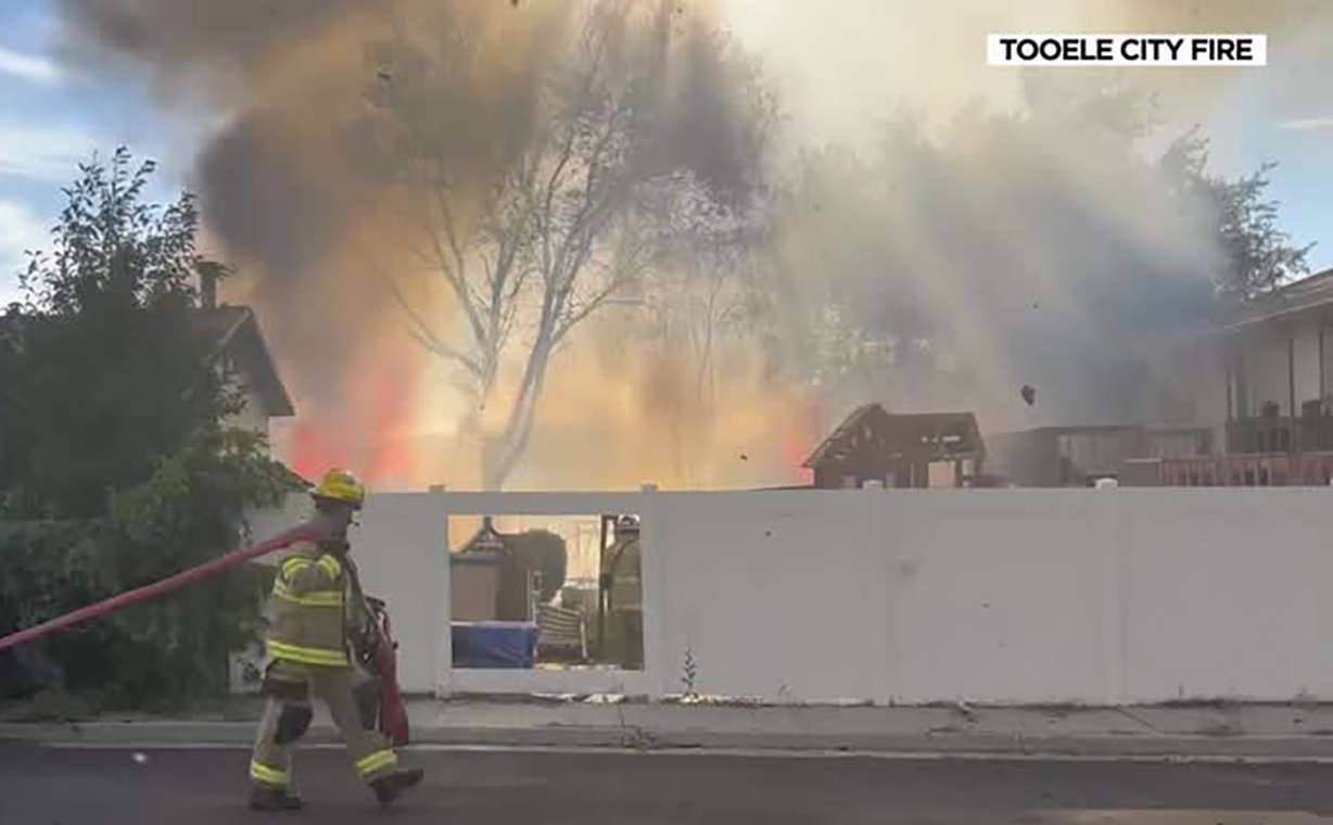 Fire tore through a Tooele neighborhood Wednesday evening, destroying three sheds and damaging five homes.