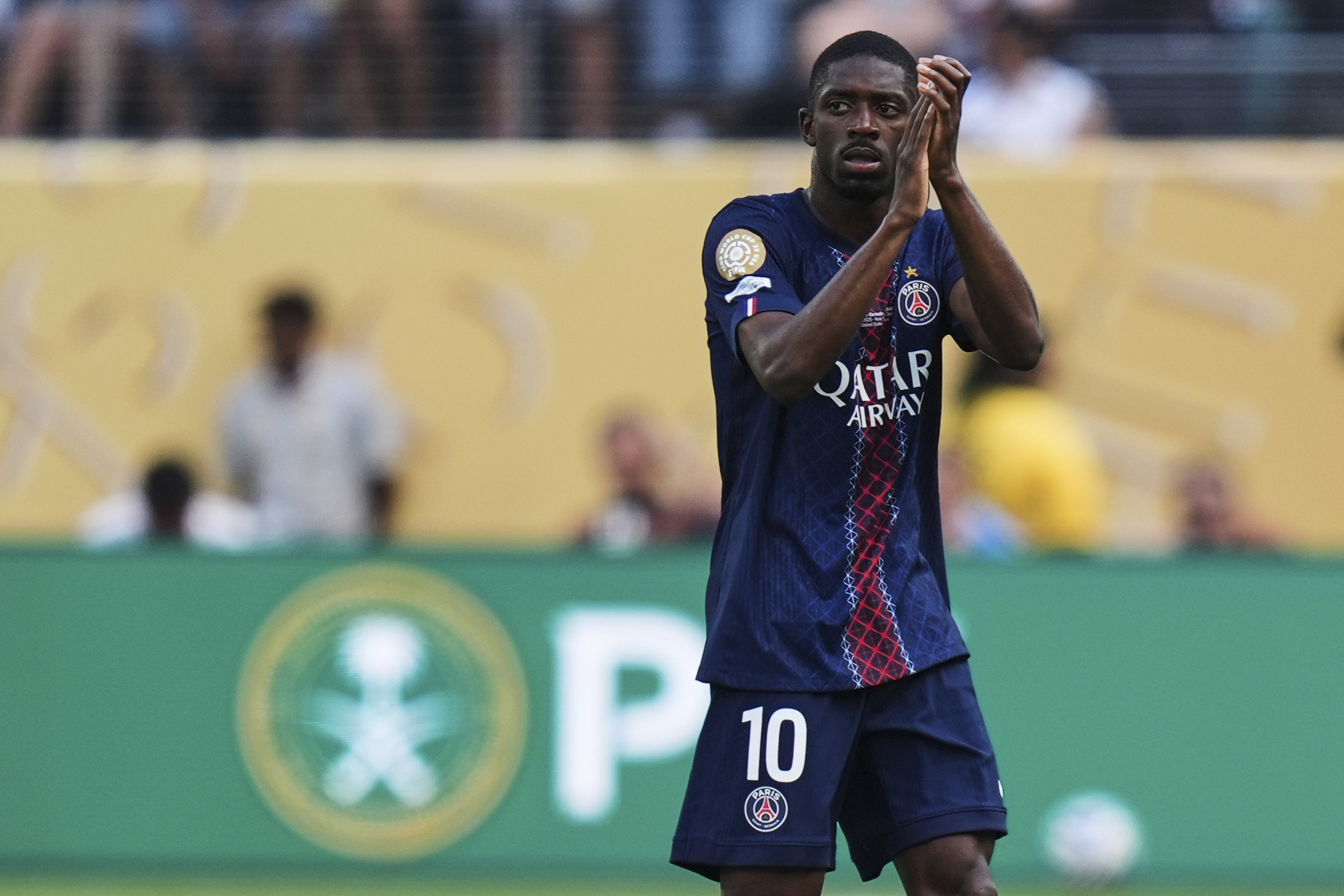 Paris Saint-Germain's Ousmane Dembele (10) applauds fans as he comes out during the Club World Cup semifinal soccer match between PSG and Real Madrid in East Rutherford, N.J., Wednesday, July 9, 2025.