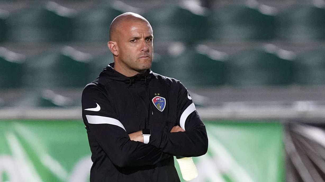 FILE - North Carolina Courage interim coach Sean Nahas waits for the team's NWSL soccer match against Racing Louisville FC in Cary, N.C., Oct. 6, 2021.