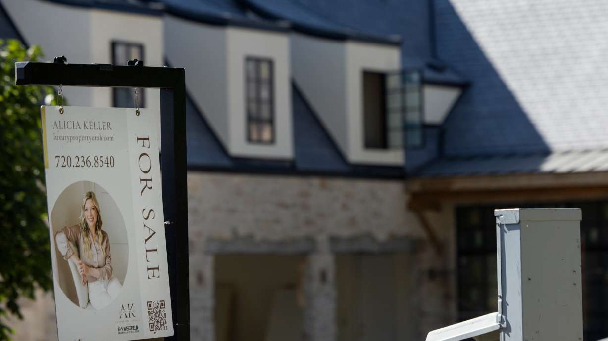 A real estate sign is posted near a home in Draper, July 10. The weekly average for a 30-year fixed-rate mortgage fell to 6.63% Thursday.