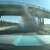 Idaho truck driver narrowly misses being struck by a backhoe 'cartwheeling' through the air