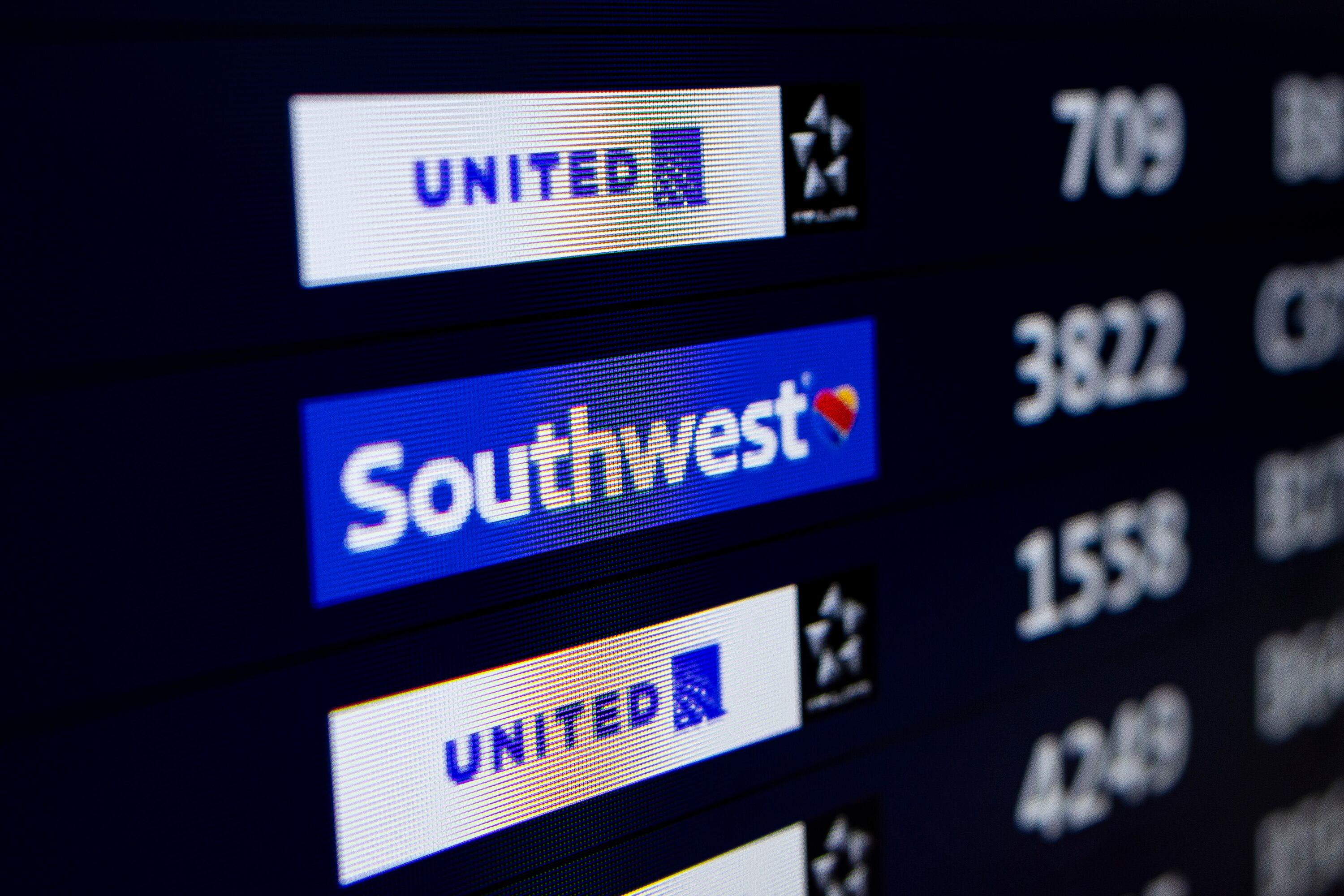 A Southwest Airlines flight is listed on a screen of departures at the Denver International Airport in Denver, Colo., on March 23.