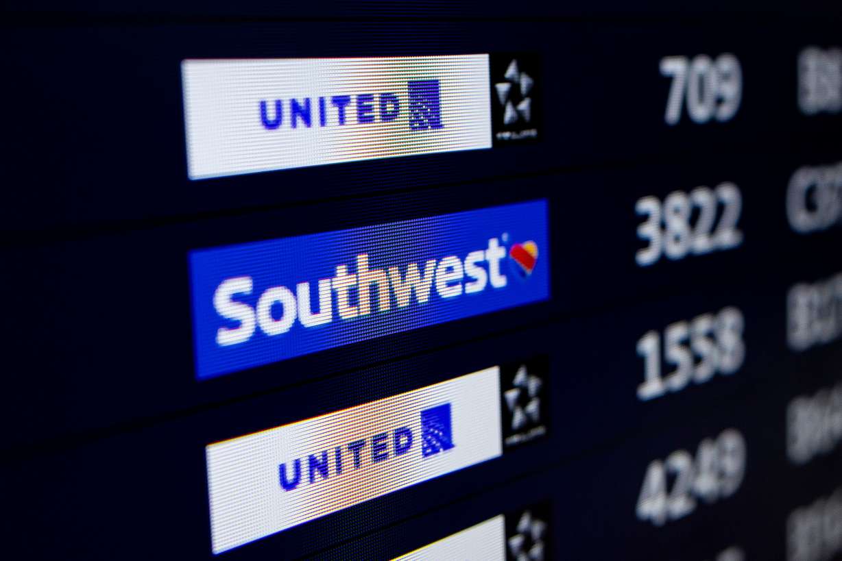 A Southwest Airlines flight is listed on a screen of departures at the Denver International Airport in Denver, Colo., on March 23.