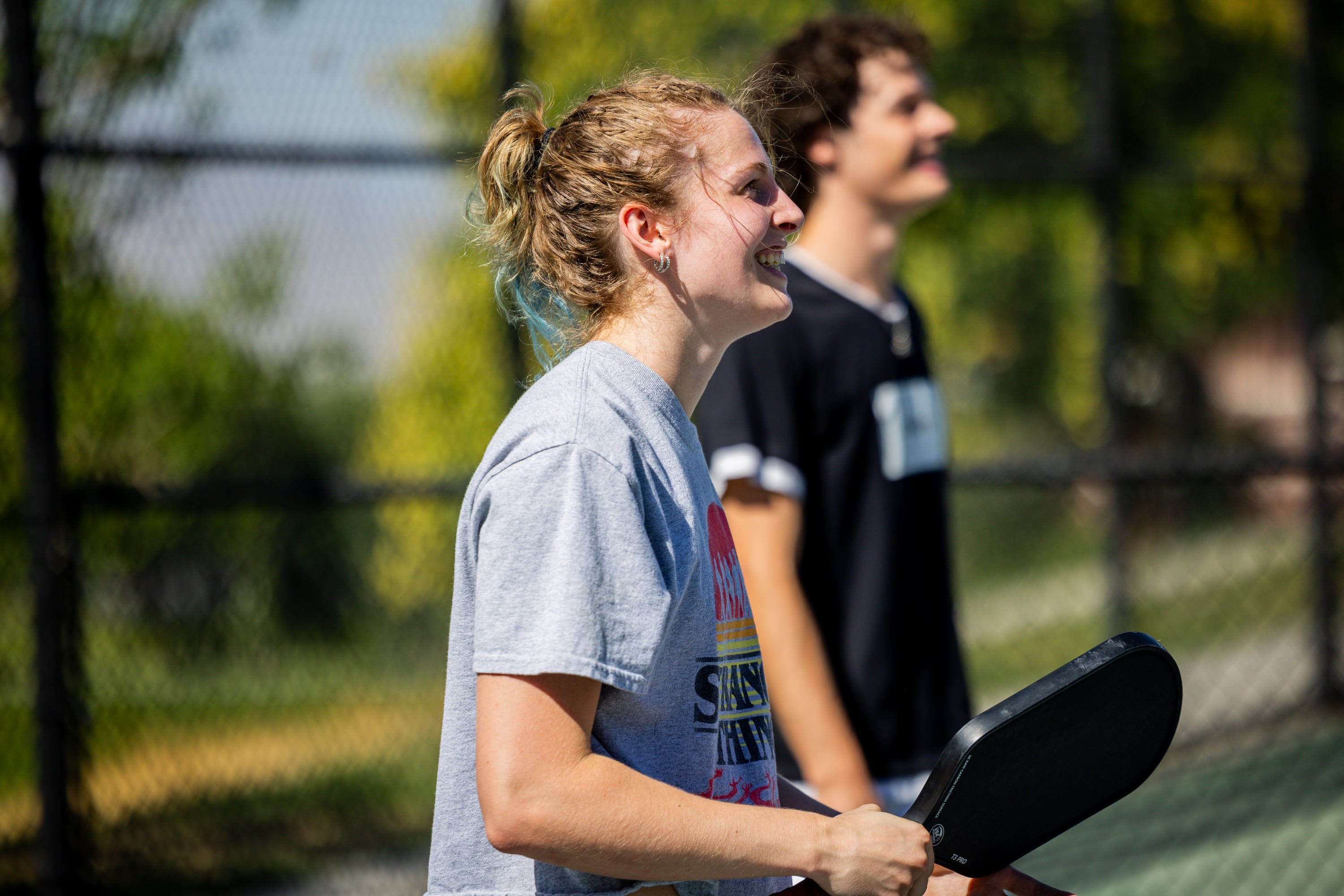 Caprina Mathias and Lincoln Ferrin play pickleball in Salt Lake City on Thursday. Mathias first tried pickleball 2 1/2 years ago and has been playing it ever since.