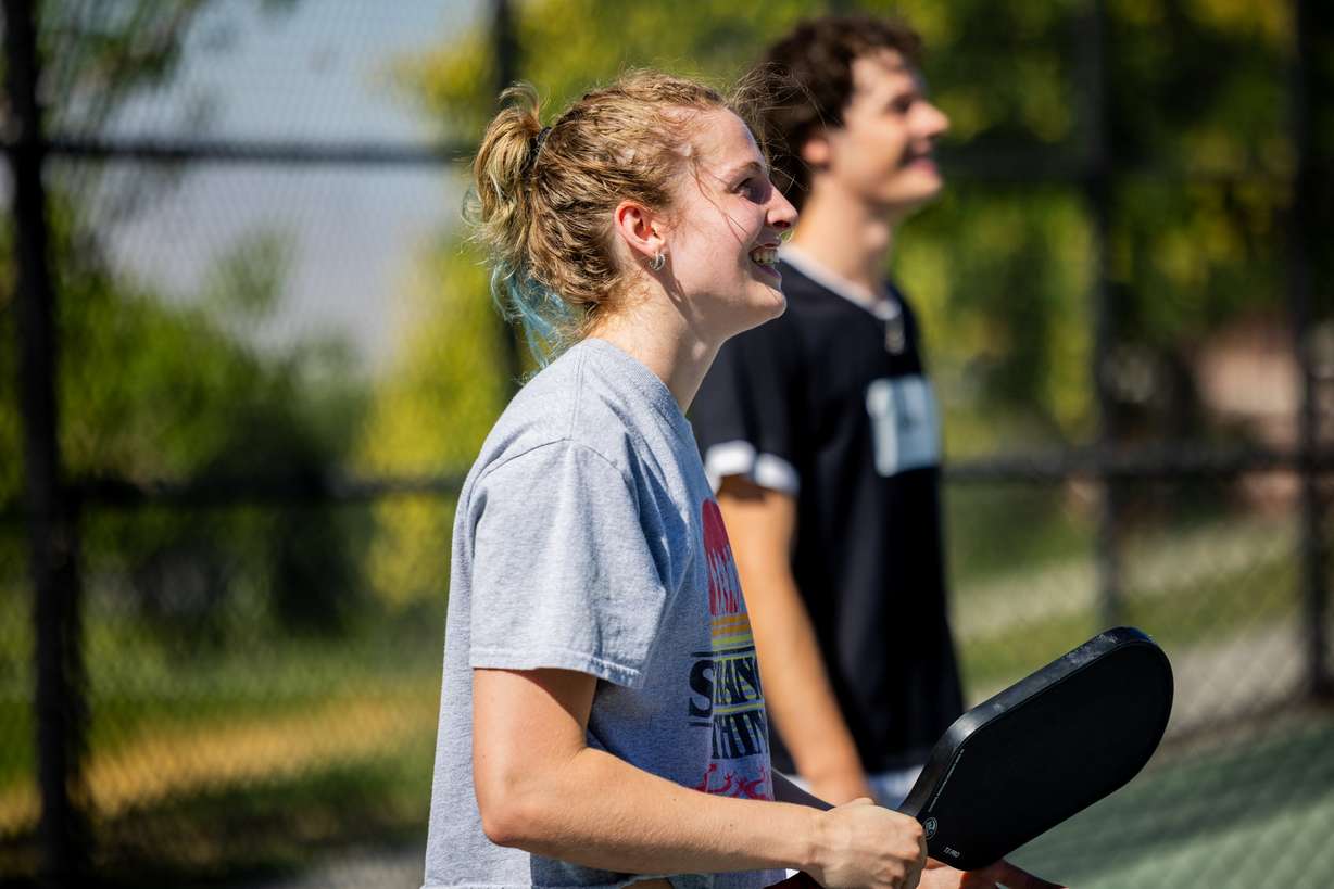 Caprina Mathias and Lincoln Ferrin play pickleball in Salt Lake City on Thursday. Mathias first tried pickleball 2 1/2 years ago and has been playing it ever since.