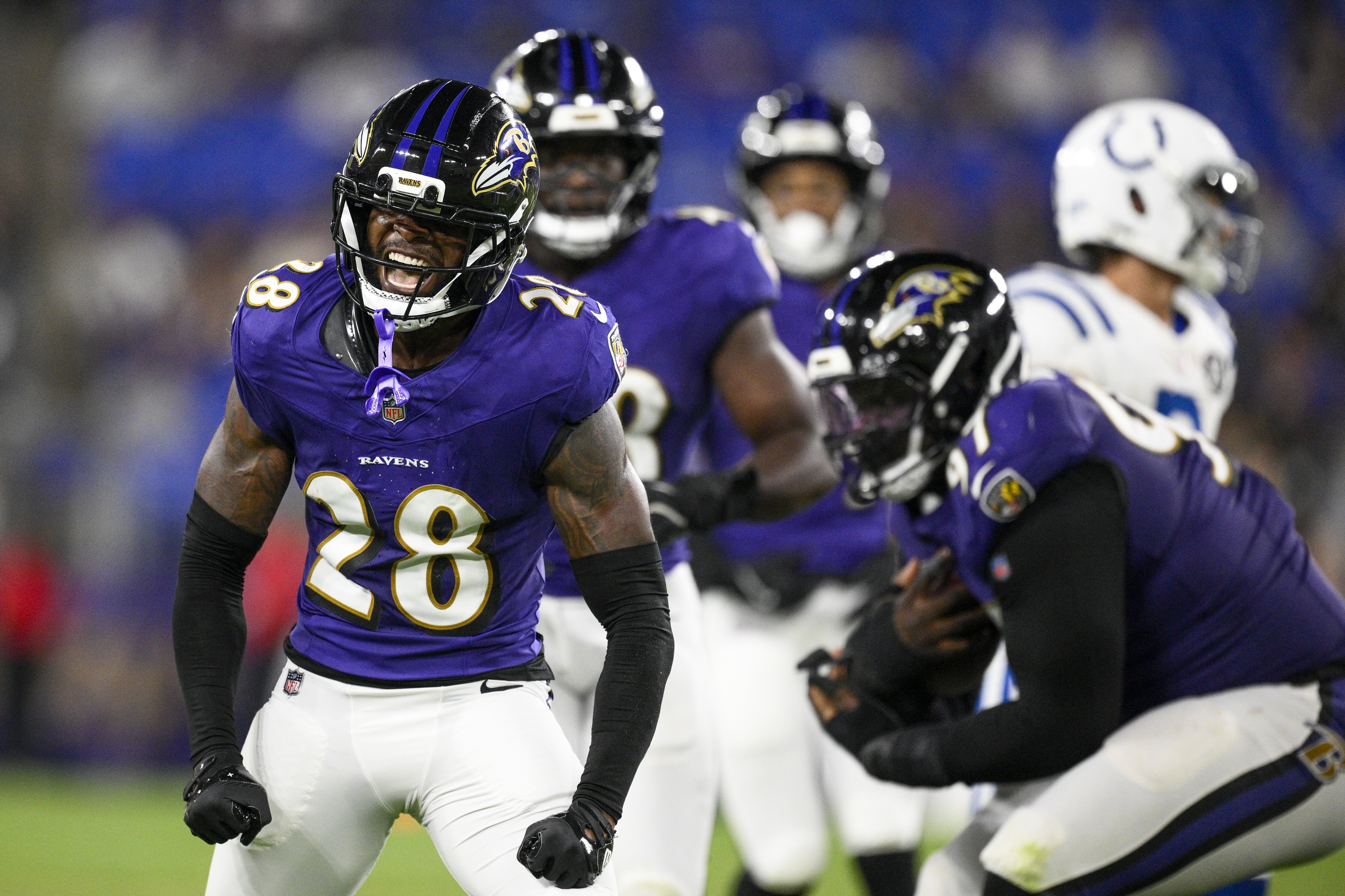 Baltimore Ravens cornerback Marquise Robinson (28) reacts after making a hit on Indianapolis Colts running back Ulysses Bentley IV, not visible, during the second half of an NFL preseason football game Thursday, Aug. 7, 2025, in Baltimore.