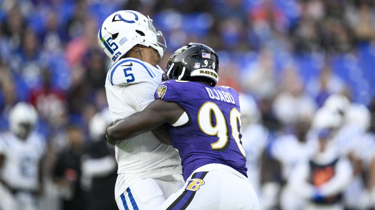 Indianapolis Colts quarterback Anthony Richardson Sr. (5) is sacked by Baltimore Ravens linebacker David Ojabo (90) during the firs half of an NFL preseason football game Thursday, Aug. 7, 2025, in Baltimore.