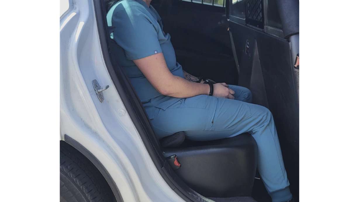 Florida woman Autumn Bardisa is taken into custody Tuesday, in Palm Coast, Fla.