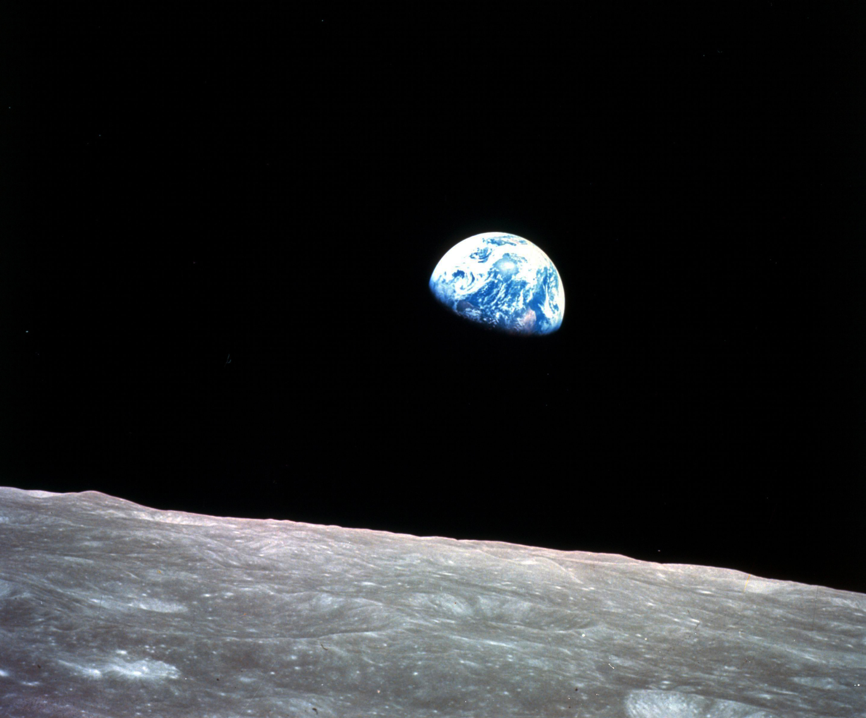 This Dec. 24, 1968, file photo made available by NASA shows the Earth behind the surface of the moon during the Apollo 8 mission.