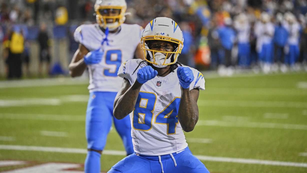 Los Angeles Chargers wide receiver KeAndre Lambert-Smith (84) celebrates his touchdown in the first half of the Pro Football Hall of Fame NFL preseason game against the Detroit Lions, Thursday, July 31, 2025, in Canton, Ohio.