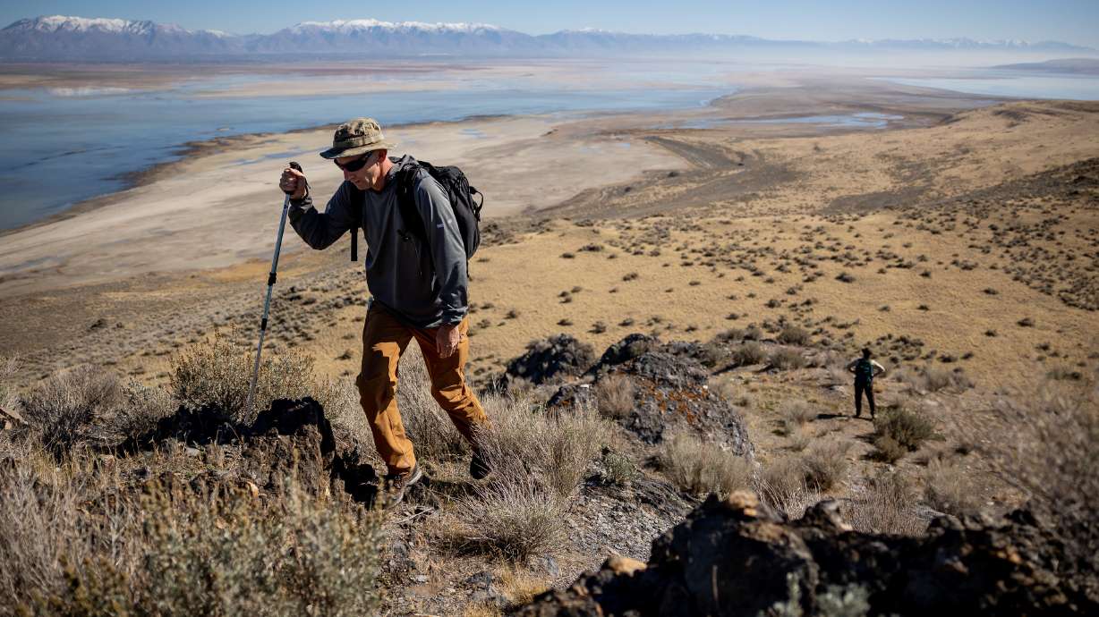 Jason Curry, then-deputy director of the Utah Division of Forestry, Fire and State Lands, hikes on Fremont Island while giving journalists a tour on Oct. 21, 2021. Fremont Island could become a potential reintroduction site for bighorn sheep.