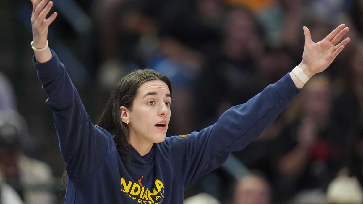Indiana Fever guard Caitlin Clark reacts during the first half of a WNBA basketball game against the Dallas Wings Friday, Aug. 1, 2025, in Dallas.