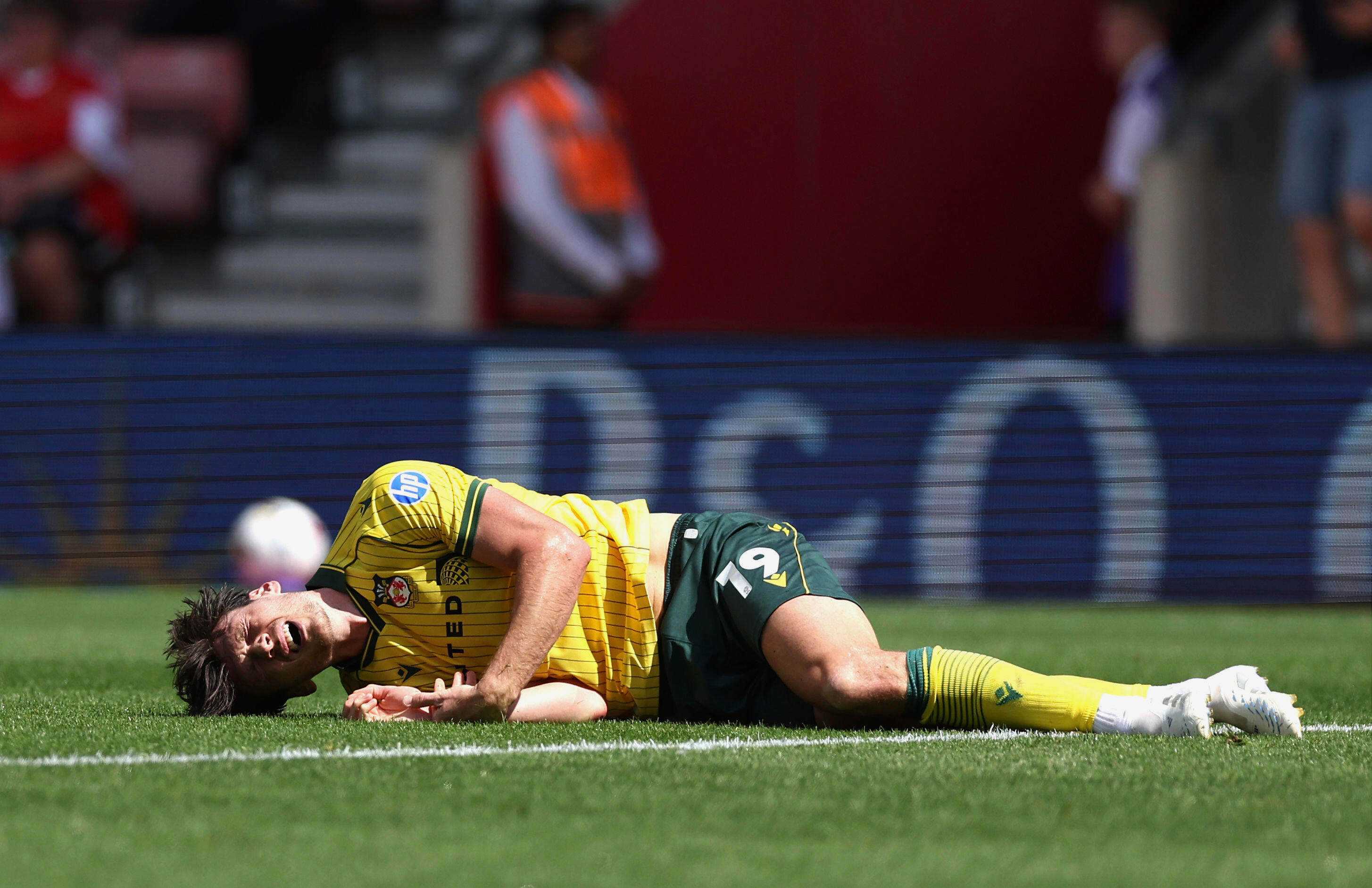 Wrexham's Kieffer Moore lays injured during their English Football League Championship soccer match against Southampton, at St Mary's Stadium, Southampton, England, Saturday, Aug. 9, 2025.