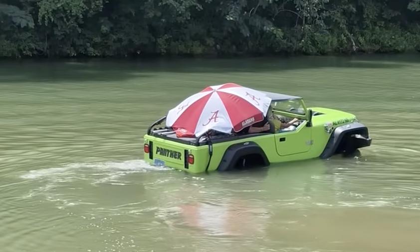 Driver surprises everyone with amphibious journey.