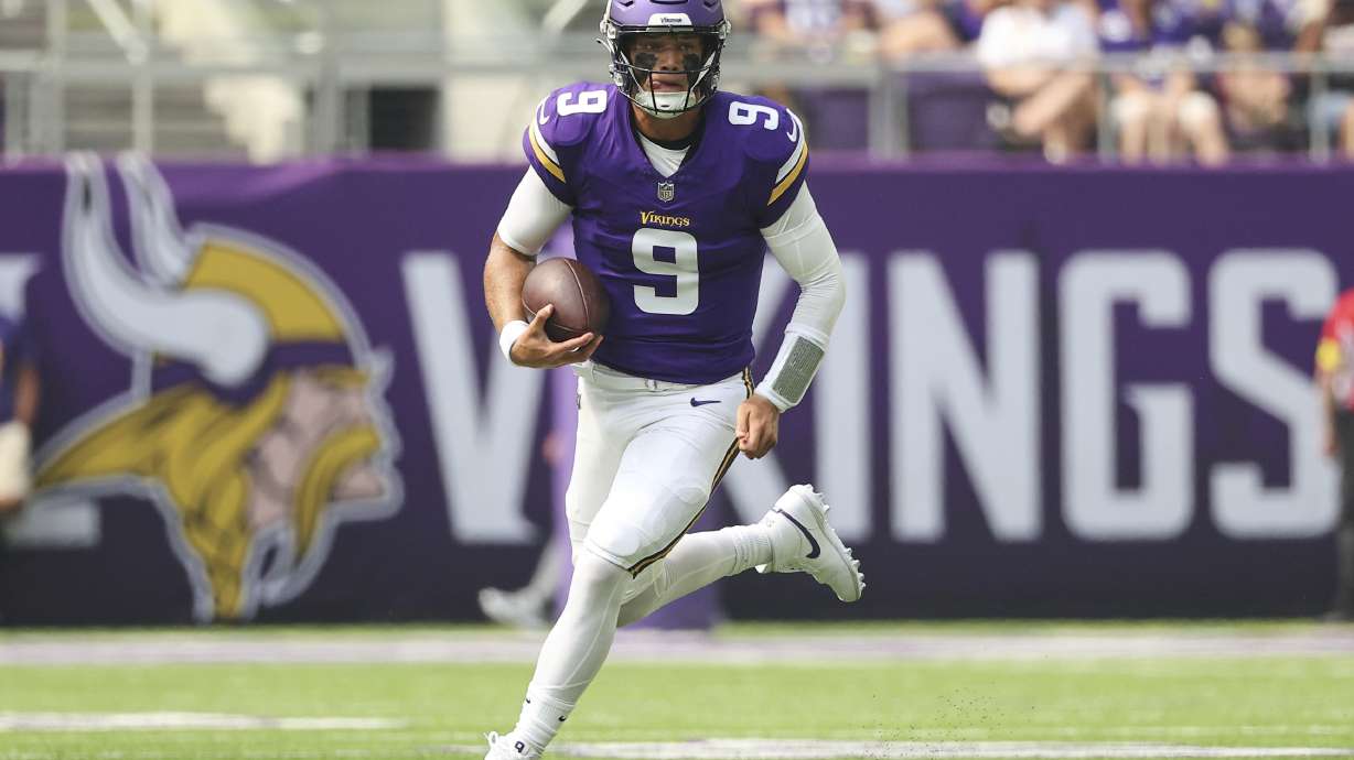 Minnesota Vikings quarterback J.J. McCarthy runs the ball during the first half of an NFL preseason football game against the Houston Texans, Saturday, Aug. 9, 2025, in Minneapolis.