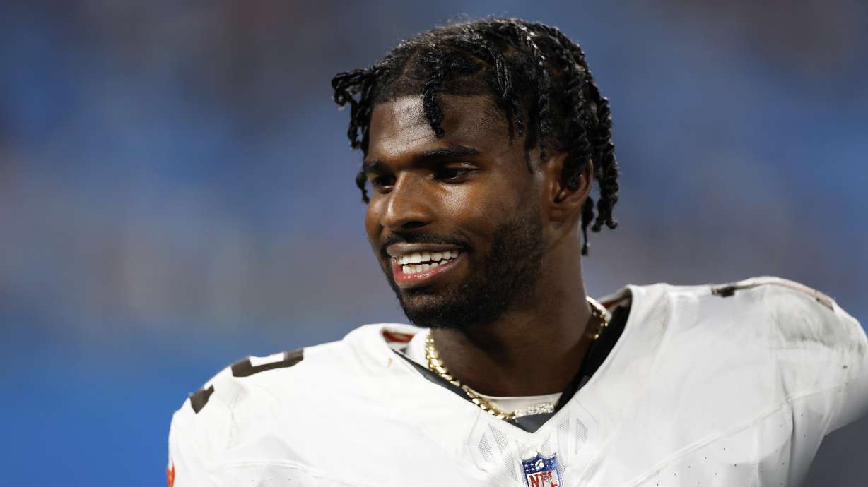 Cleveland Browns quarterback Shedeur Sanders watches during the first half of a preseason NFL football game against the Carolina Panthers on Friday, Aug. 8, 2025, in Charlotte, N.C.