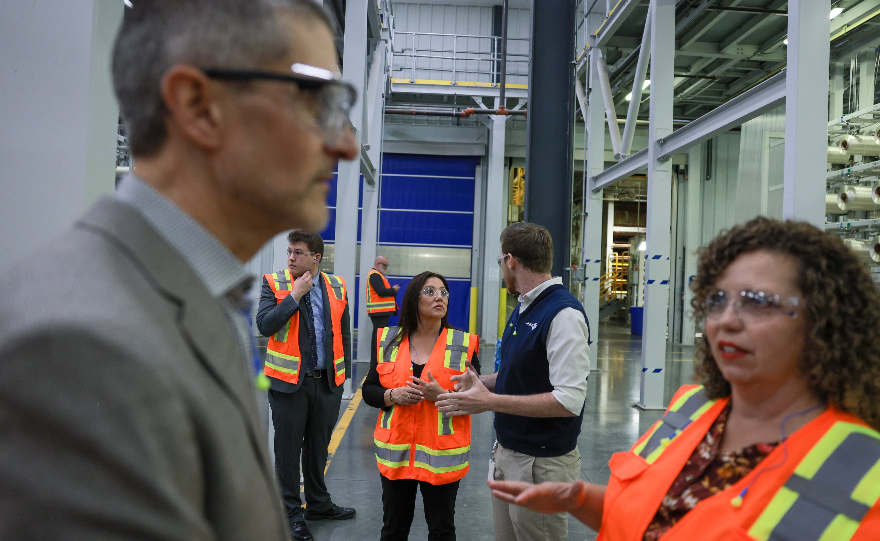 U.S. Secretary of Labor Lori Chavez-DeRemer, center left, talks with Drew Patterson, plant manager for fibers, center right, during a tour of Hexcel’s facilities in West Valley City on Friday.