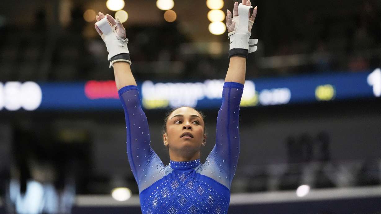 Hezly Rivera of WOGA reacts after competing on the uneven bars during the senior women's finals of the U.S. Gymnastics Championships in New Orleans, Sunday, Aug. 10, 2025.