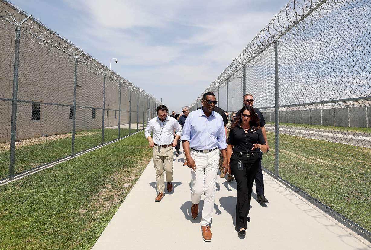 Rep. Burgess Owens, R-Utah, talks with Rebecca Brown, Utah Department of Corrections deputy executive director, while touring the Utah State Correctional Facility in Salt Lake City, Aug. 4.