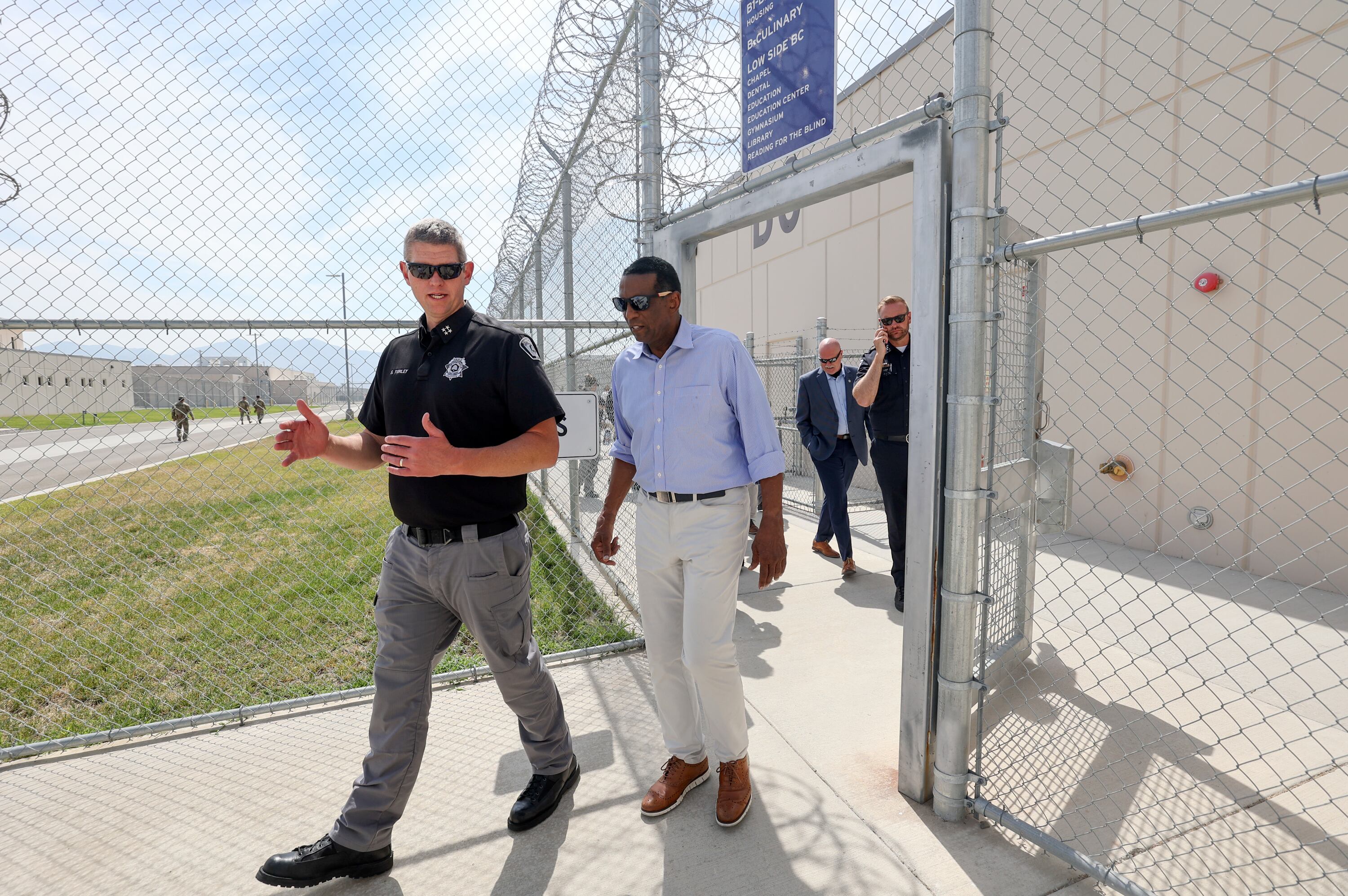 Spencer Turley, Utah Department of Corrections deputy executive director, talks with Rep. Burgess Owens, R-Utah, as Owens tours the Utah State Correctional Facility in Salt Lake City, Aug. 4.