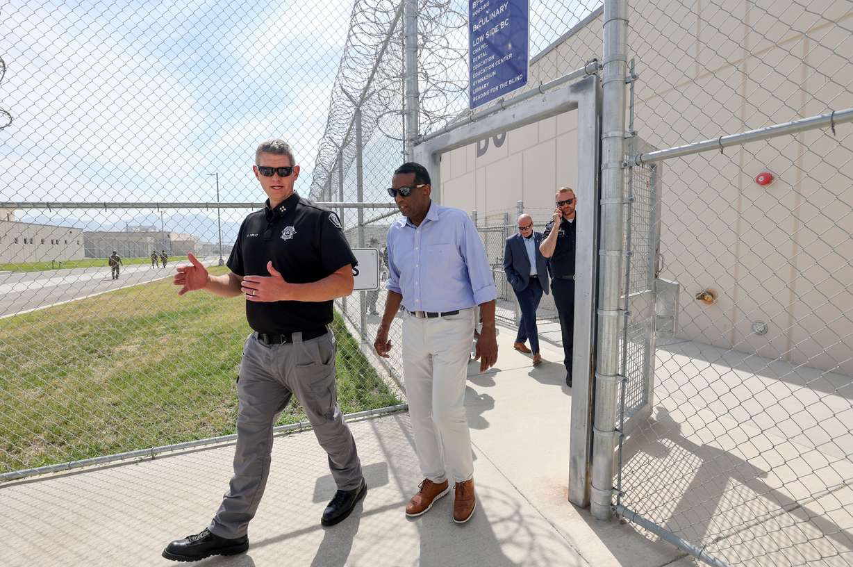 Spencer Turley, Utah Department of Corrections deputy executive director, talks with Rep. Burgess Owens, R-Utah, as Owens tours the Utah State Correctional Facility in Salt Lake City, Aug. 4.