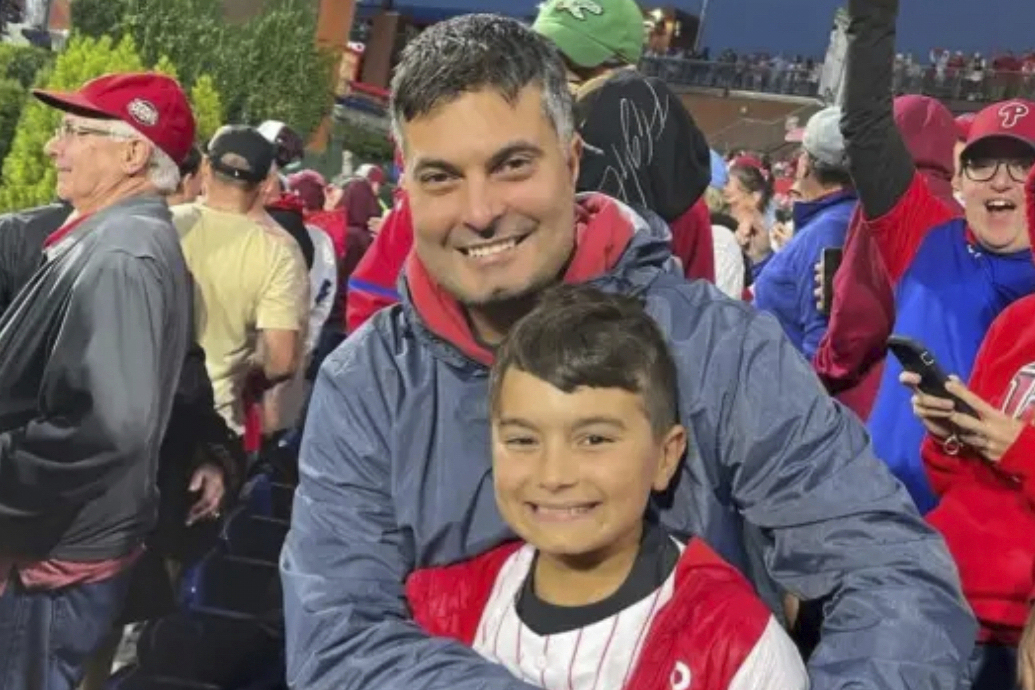 FILE - In this undated photo provided by Joseph "Joe" Rocco, he and his son, Marco Rocco, pose for a photo in Haddonfield, N.J.