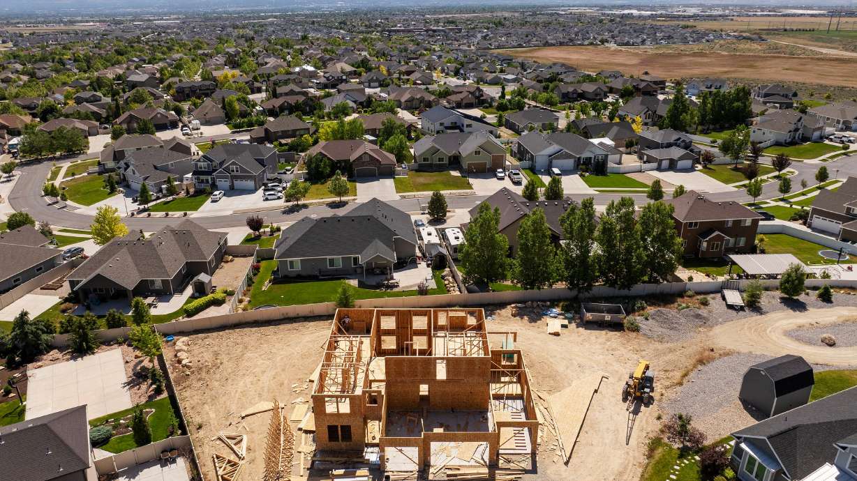 Work continues on a new home in West Jordan on June 3. Redfin says there's nearly $700 billion in unsold houses on the market nationwide, a record high.