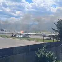 Plane crashes into parked aircraft while landing at Montana airport, sparking fire