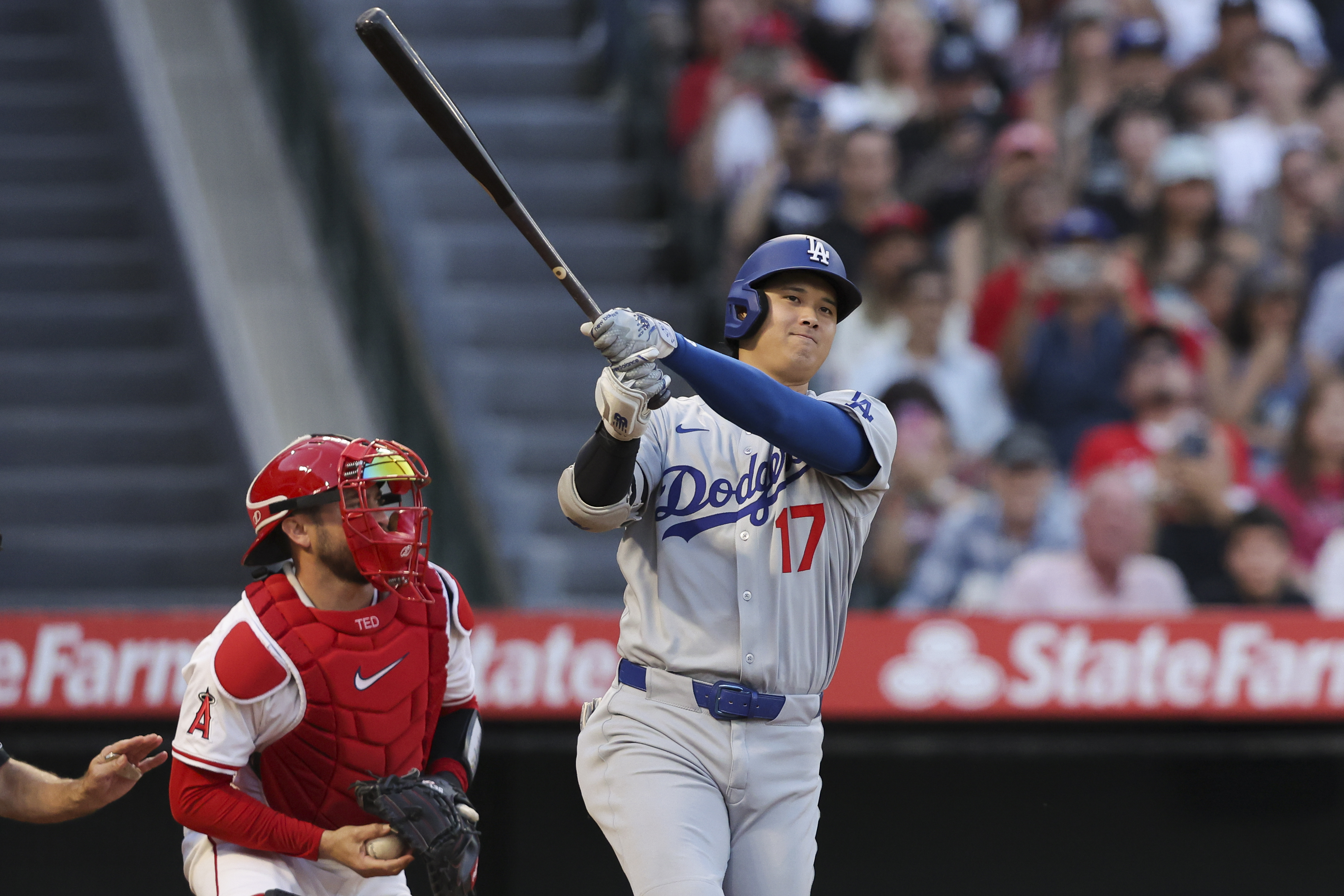 Los Angeles Dodgers designated hitter Shohei Ohtani (17) strikes out swinging as Los Angeles Angels catcher Travis d'Arnaud, left, prepares to throw the ball during the third inning of a baseball game, Monday, Aug. 11, 2025, in Anaheim, Calif.