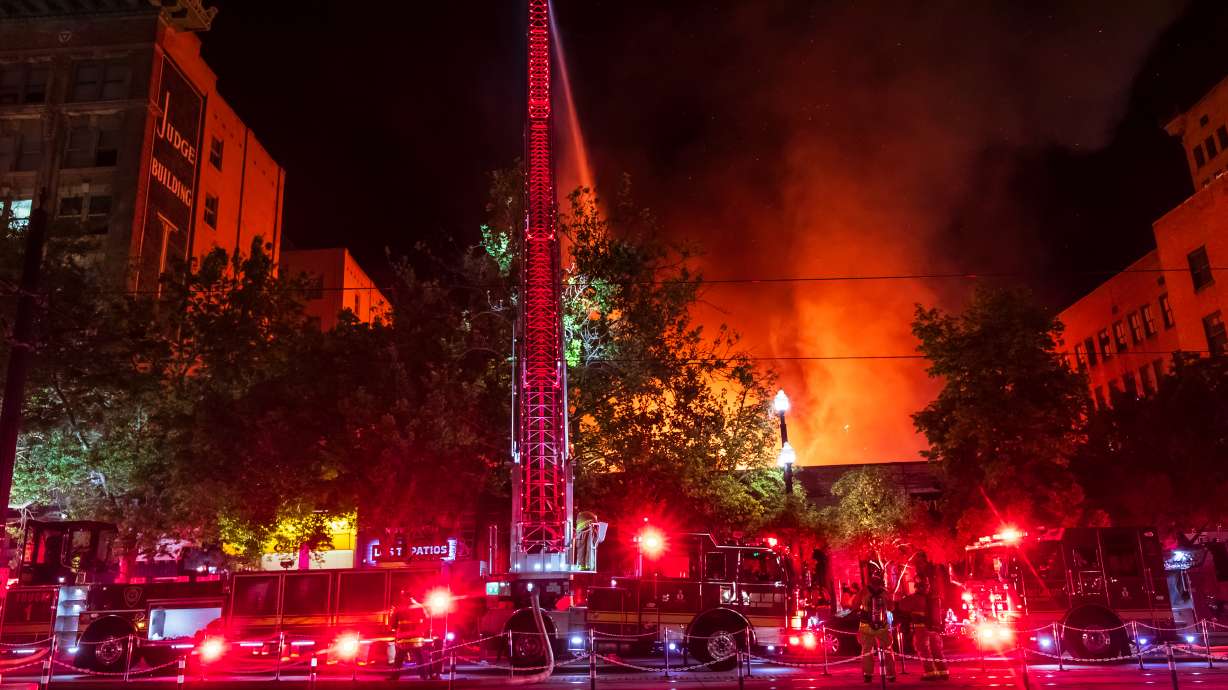 Firefighters respond to a large structure fire in downtown Salt Lake City Monday night. Authorities say the fire likely impacted multiple businesses in the area.
