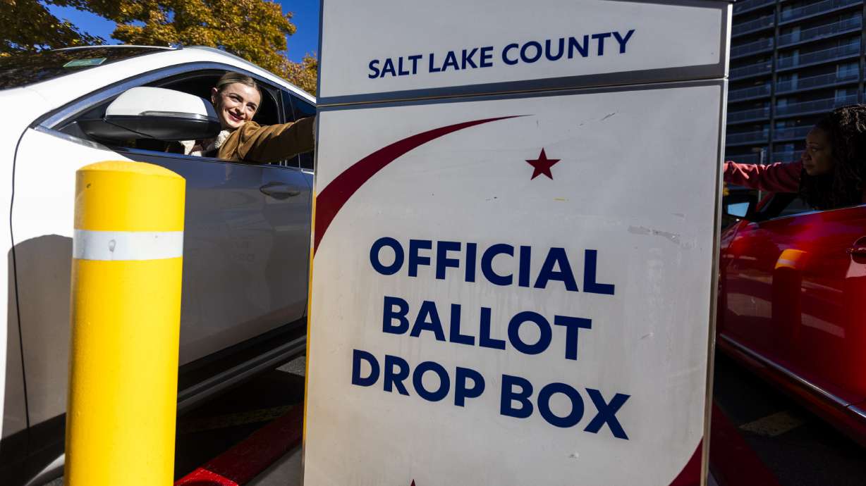 Jaiden Robinson drops a ballot at the Salt Lake County Government Center in Salt Lake City on Nov. 4, 2024.